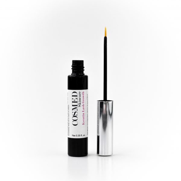 Eyelash Growth Serum open vial with a brush in a lid